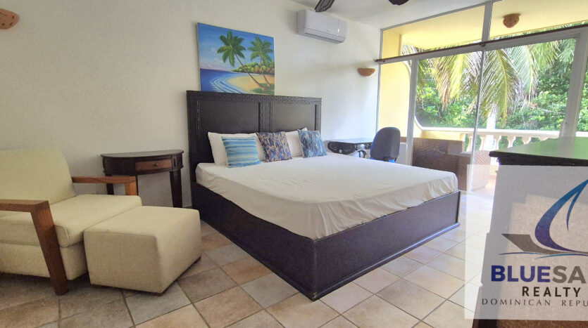 Beds and chair in penthouse bedroom